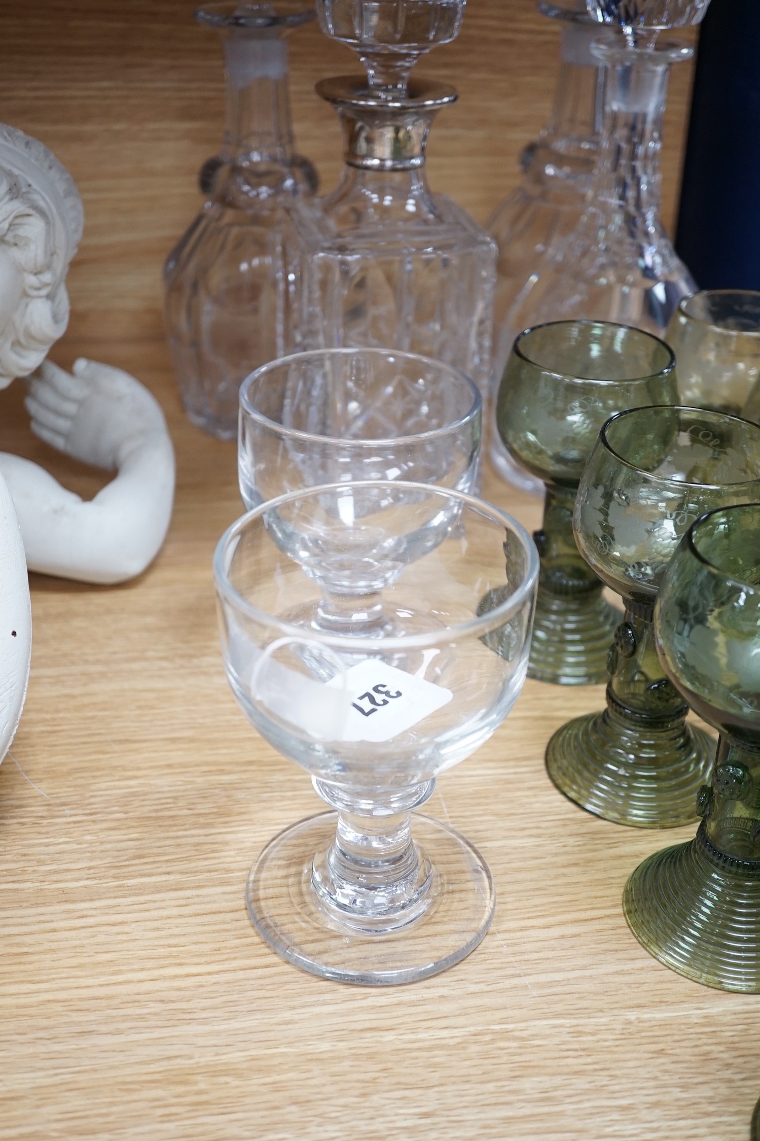 A pair of rummers, three glass decanters, a silver mounted decanter and nine etched green glass goblets, tallest 34cm